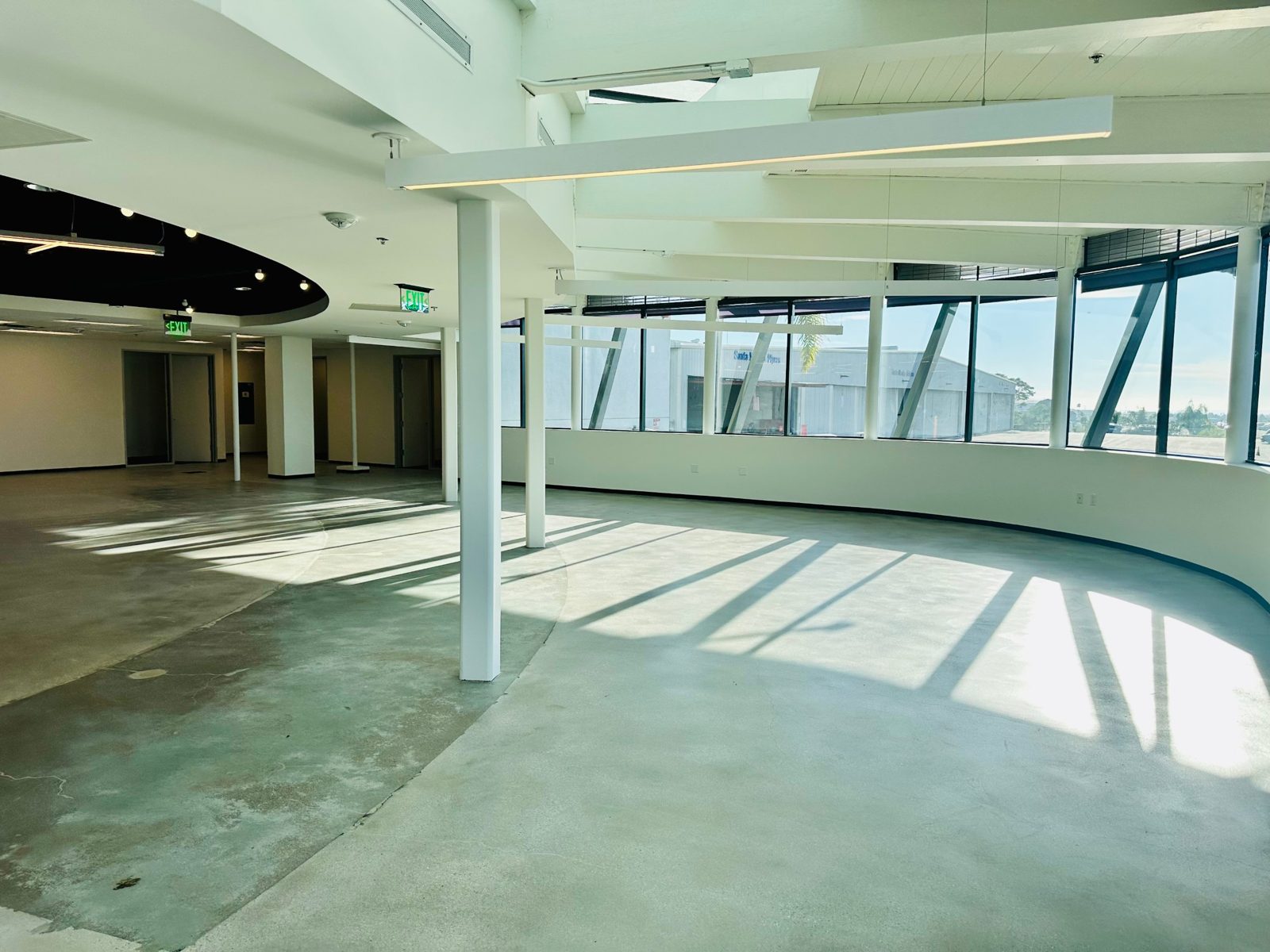 Open work area with floor-to-ceiling windows